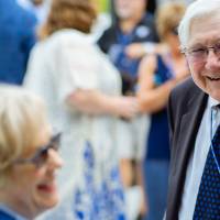 President Emeritus Don and Nancy Lubbers laughing together at the Jamie Hosford Football Center dedication.